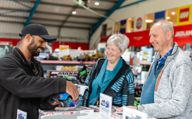 Friendly Jadlam staff member assisting a customer