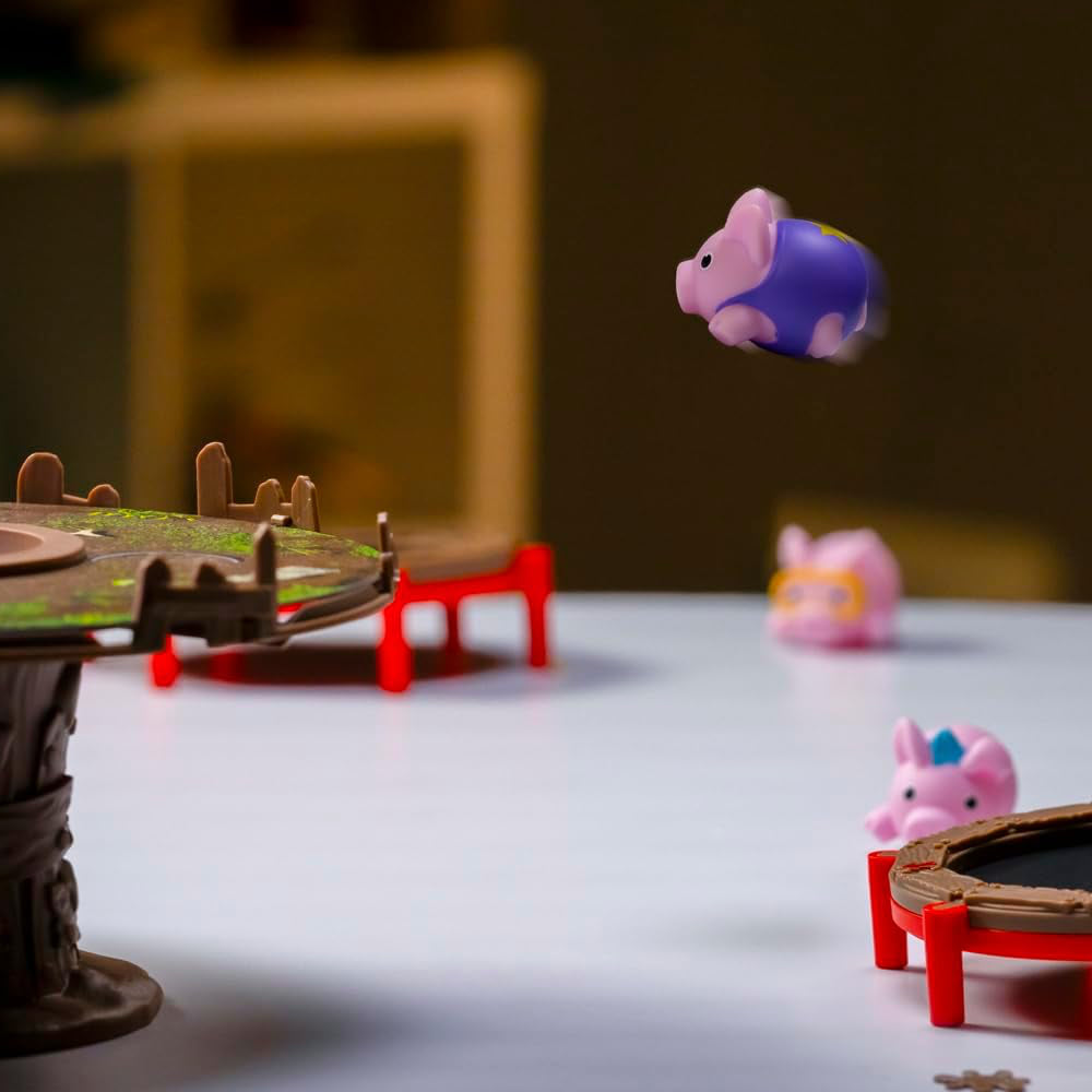 Pigs on Trampolines Board Game - Age 6+ PlayMonster