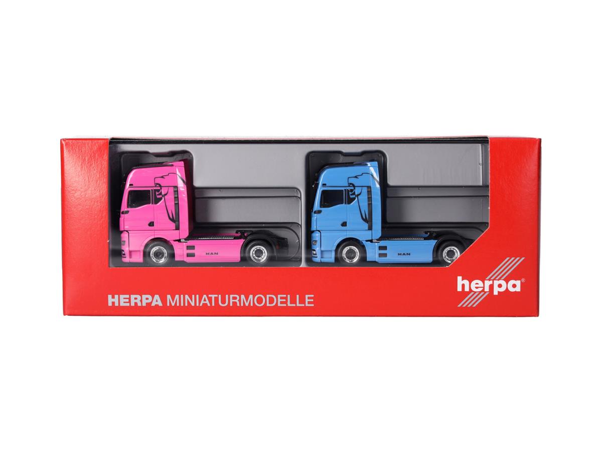 Herpa MAN & WOMAN eTGX GX 2 Axle Rigid Tractor Set (2) Blue/Pink 319195 HO Gauge